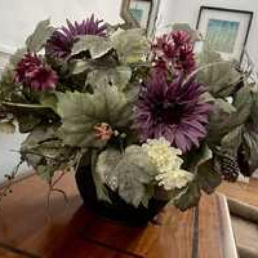Faux flower arrangement in pot